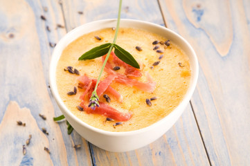 fresh melon soup with parma ham and lavender flower