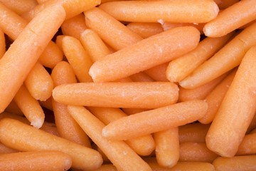 Raw mini baby carrots closeup