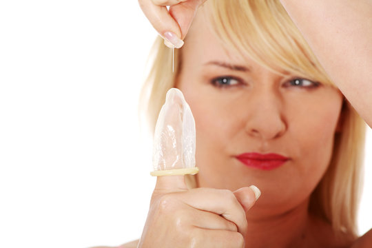 Mature Woman Making Hole In Condom