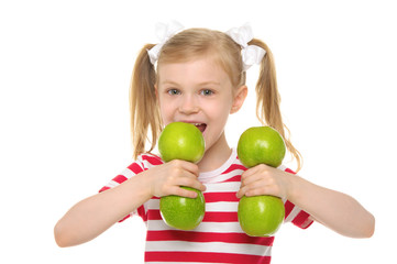 Fototapeta na wymiar Girl bites dumbbell from apples