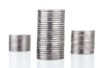 Silver coins stacks on white