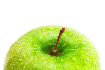 big green apple with water drops isolated on white