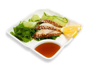 salad of warm smoked eel with pickled cucumbers and seaweed