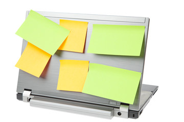 Laptop notebook isolated on white with postits on it