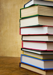 pile of new and old books on wood