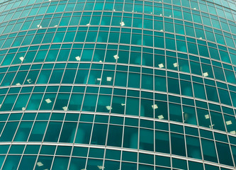 green transparent glass wall of office building