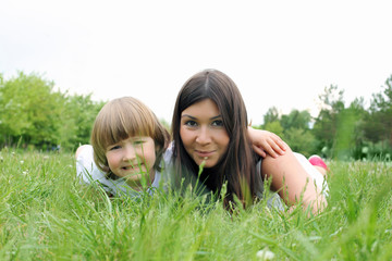 itlle girl with her mother outdoors