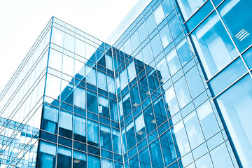 Fototapeta na wymiar low angle view to light glass buildings of business center