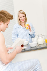 Fototapeta na wymiar Breakfast happy couple eat cereal drink juice