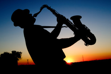 Saxophonist at sunset