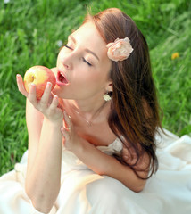 beautiful young girl with an apple