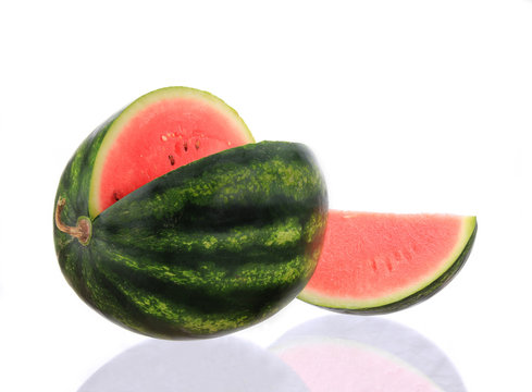 Close-up of melon over white background
