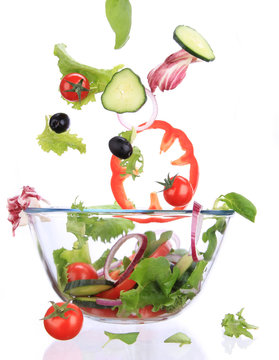 Fresh salad with vegetable in motion.