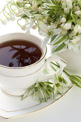 Lily of the valley and a cup of tea