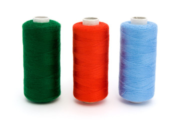 Three rolls of different color cotton