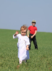 Fototapeta premium The nice girl and the boy on a background of the nature