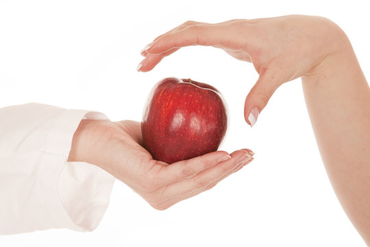 Hand Grabbing Apple From Another