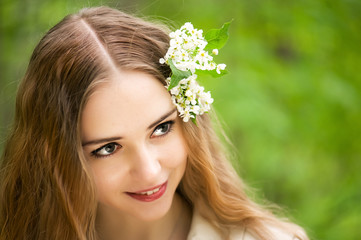 Fototapeta premium pretty young girl with flowers