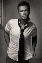 Young man portrait, on a dark background