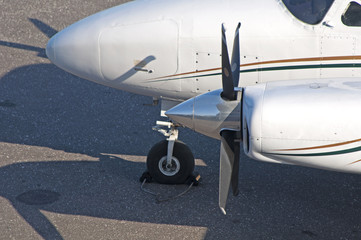 Close up of an airplane propeller parked at a hangar