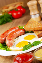 Fried eggs with sausages
