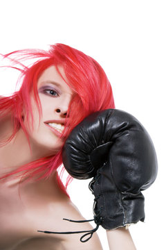 Red-hair girl receives a knockout blow in the face of boxing glo