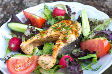 Grilled salmon on vegetables