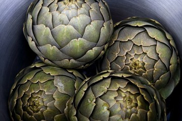 Fototapeta premium Steamed artichokes in a large pot