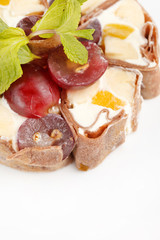 Tiramisu Sushi Roll garnished with Grapes and Mint