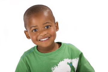 Cute happy 3 year old black boy smiling for the camera