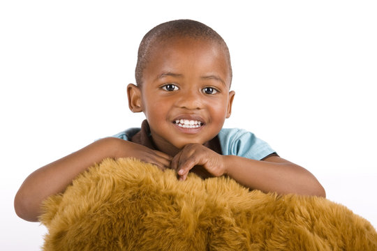 Adorable 3 Year Old Black Boy With Toy Bear Smiling Very Happily