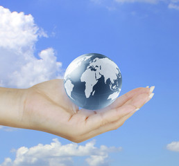 holding a glowing earth globe in his hands