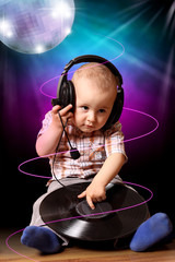 Cute child baby dj in disco