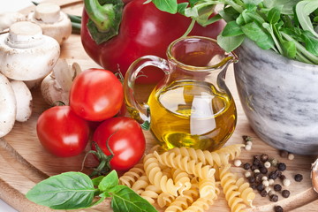 Olive oil, herbs and vegetables. Close-up shot.