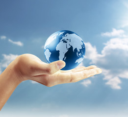 holding a glowing earth globe in his hands