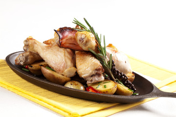 Roasted chicken drumsticks and potatoes