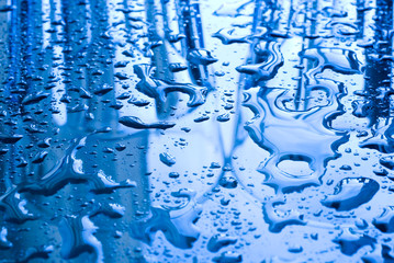 Fototapeta na wymiar Water Drops background in blue