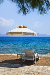 Chair and umbrella at greek beach