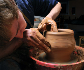 potter, creating an earthen jar on the circle