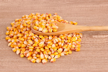 corn and spoon  on brown