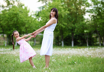 Fototapeta premium Young mother and her young daughter