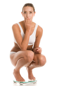 Young woman on scale
