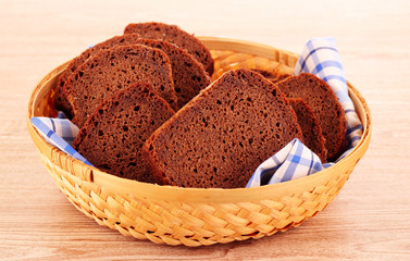 Arrangement of bread in basket isolated on white background