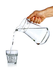 Hand pouring water from glass jug