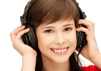 Fototapeta premium happy teenage girl in big headphones