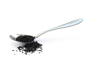 Black tea in a metal spoon