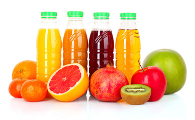 bottles of juice  with ripe fruits on white background