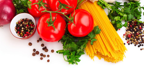 Pasta spaghetti with tomatoes, olive oil and basil on a white ba