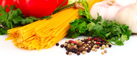 Pasta spaghetti with tomatoes, olive oil and basil on a white ba