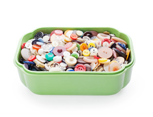 sewing buttons in green plastic casket isolated on white backgro